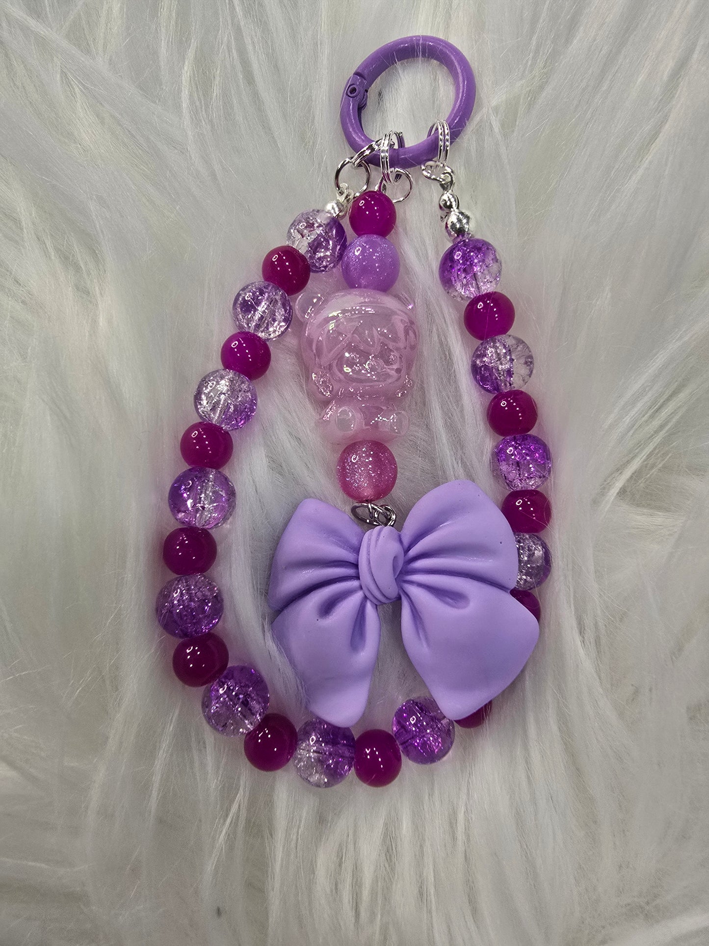 Purple Dimo and bow phone charm