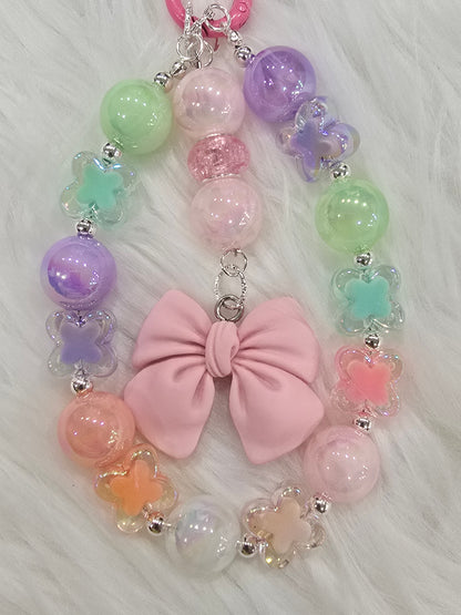 Pastel butterfly with bow phone charm