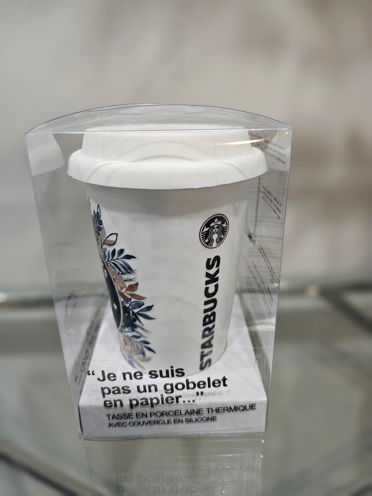 Not a paper cup with Starbucks floral design